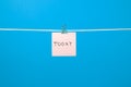 Pink paper note hanging on the string with text Ã¢â¬ÅTodayÃ¢â¬Â Royalty Free Stock Photo